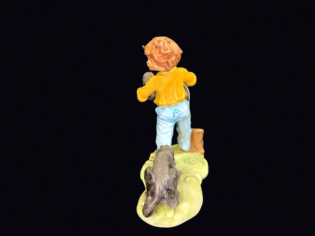 Bisque Porcelain Boy with Puppies Figurine
