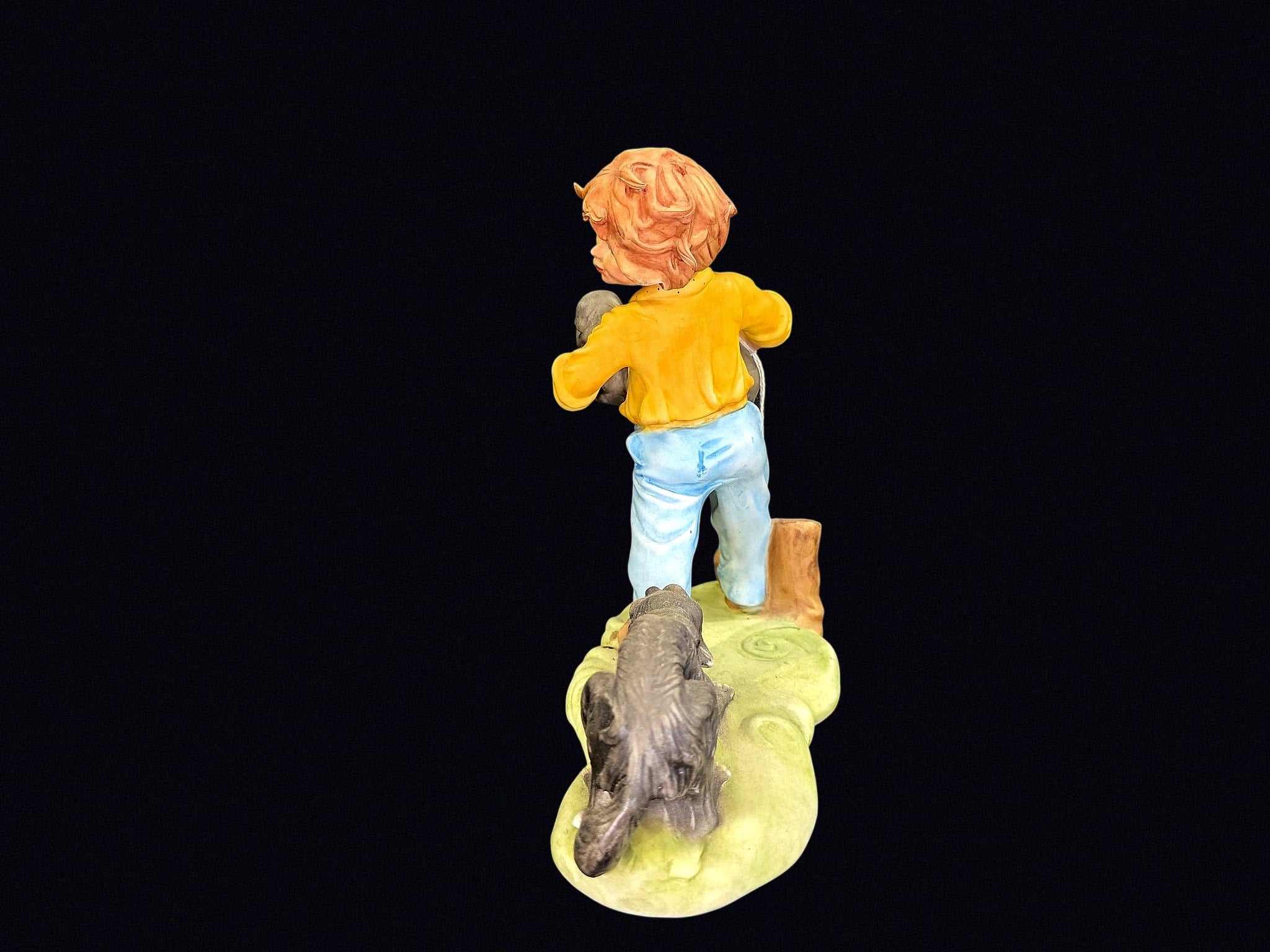 Bisque Porcelain Boy with Puppies Figurine