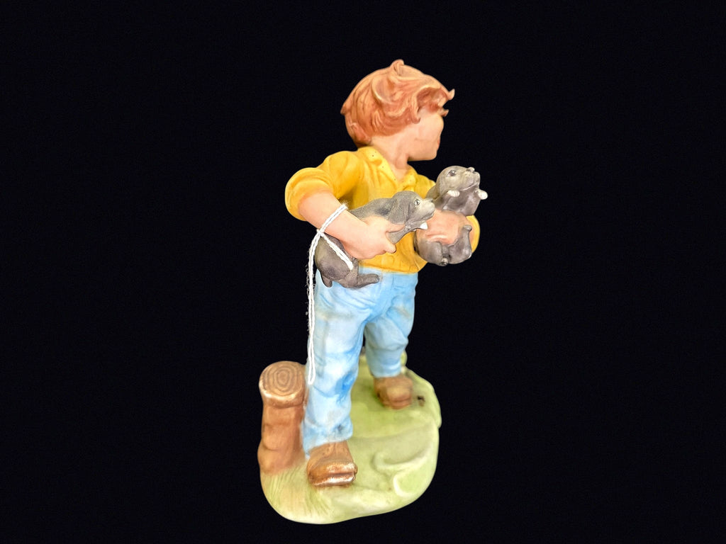 Bisque Porcelain Boy with Puppies Figurine