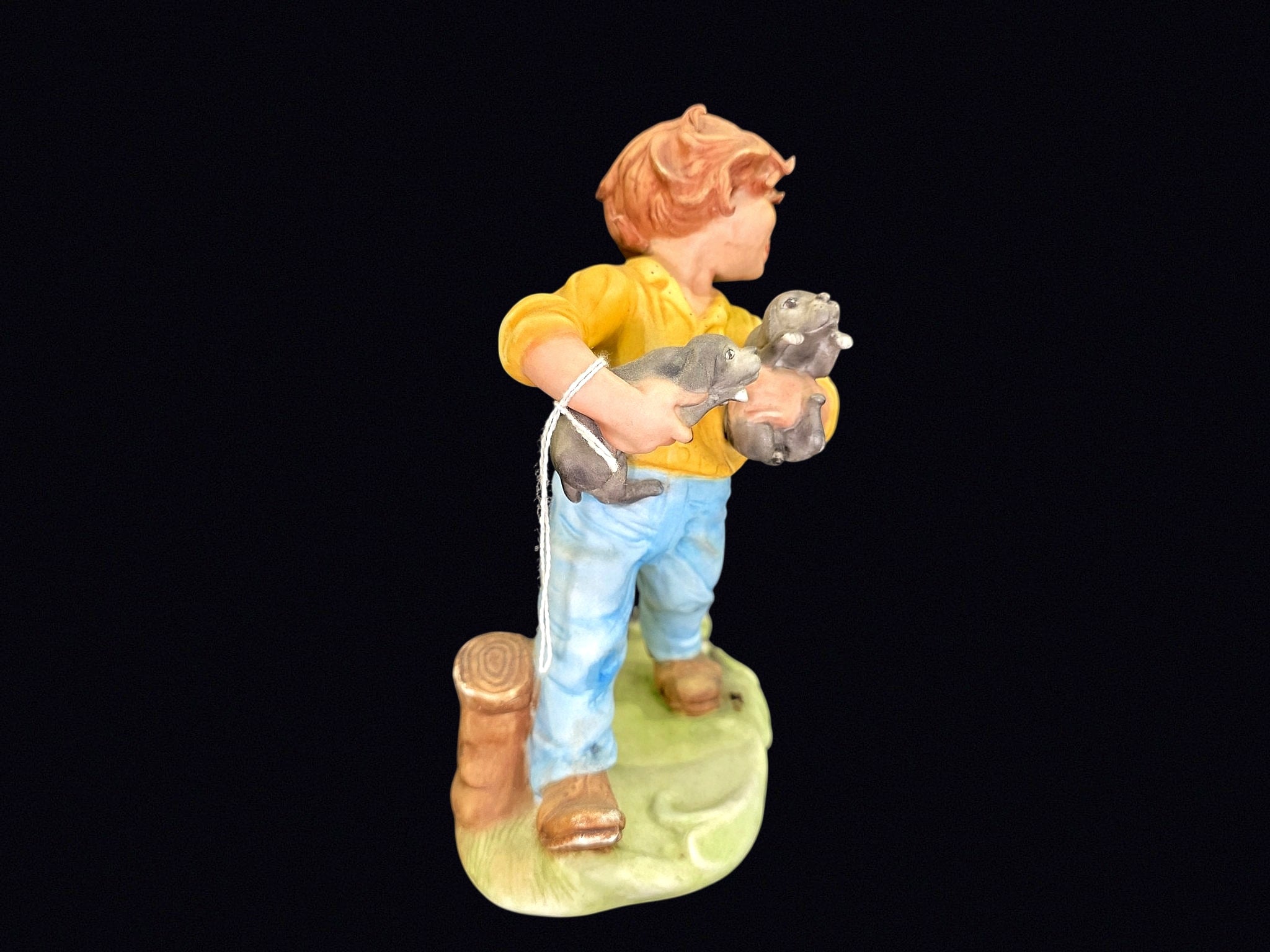 Bisque Porcelain Boy with Puppies Figurine