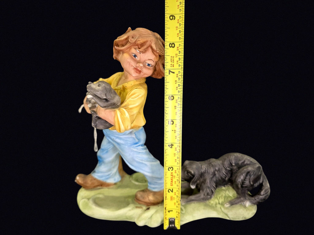Bisque Porcelain Boy with Puppies Figurine