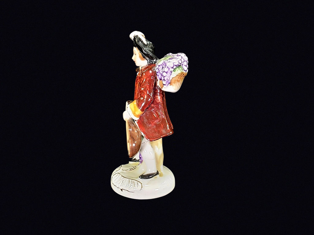 Japanese Porcelain Grape Harvester Figurine