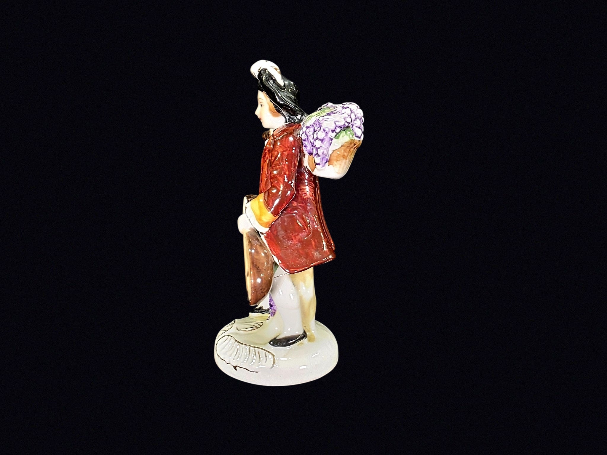 Japanese Porcelain Grape Harvester Figurine