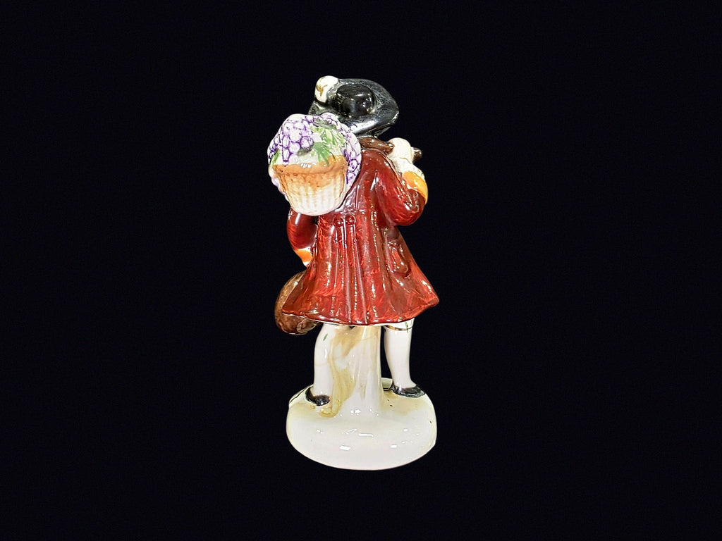 Japanese Porcelain Grape Harvester Figurine