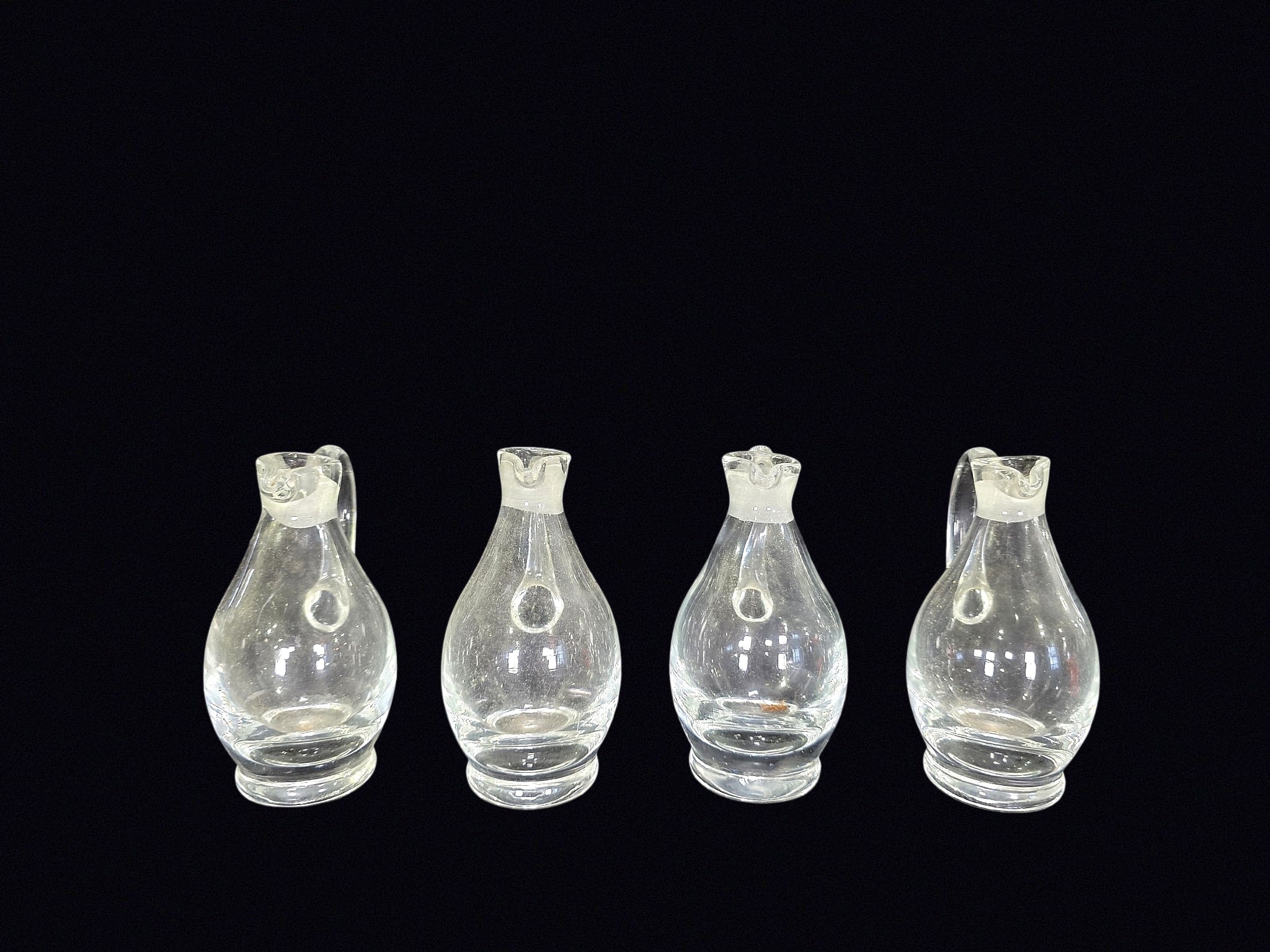 Four Mid-Century Glass Cruets Applied Handles