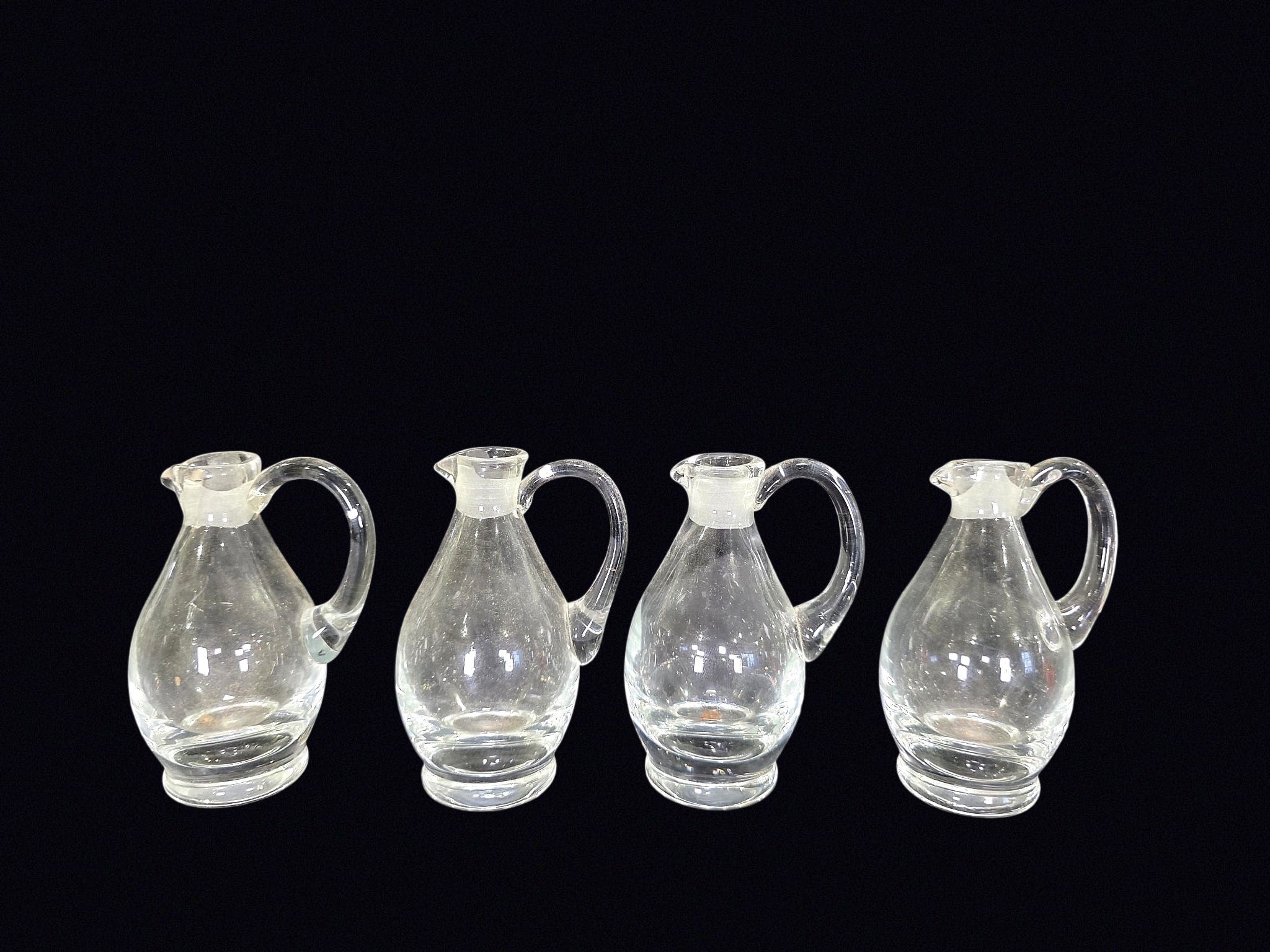 Four Mid-Century Glass Cruets Applied Handles